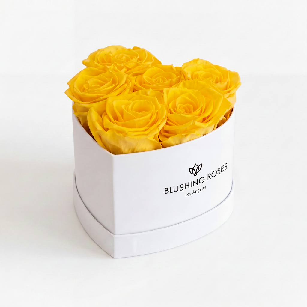 Yellow roses in a white box with Blushing Roses' logo on a white background
