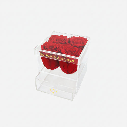 Red preserved rose arrangement in luxury acrylic flower box, romantic forever roses gift for birthdays and special occasions | Blushing Roses , Clear box with red roses and 'Blushing Roses' branding on a white background